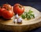 Ripe tomatoes and garlic on wood, a fresh culinary scene