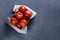 Ripe tomatoes on grey background