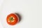 Ripe tomatoes group on plate bowl on white background, vertical