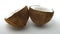 Ripe tropical coconut split in two halves rotating on white background. Looping exotic fruits.