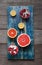 Ripe tropical fruit on a blue vintage board,