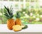 Ripe tropical pineapples on wooden table