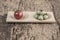 Ripe and unripe tomatoes on wooden table