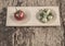 Ripe and unripe tomatoes on wooden table