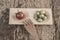 Ripe and unripe tomatoes on wooden table