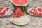 Ripe watermelon slices on stones