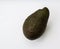 Ripe whole avocado on white background