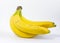 Ripe yellow bananas.A bunch of ripe bananas with dark spots on a white background