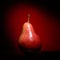 Ripen pear on red background