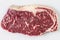 Ripened seasoned beef rump or striploin steak on white background isolated