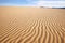 ripple patterns on the surface of sand dunes