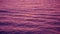 Ripple waves reflect the post sunset purple sky