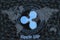 Ripple XRP Abstract Cryptocurrency. With a dark background and a world map. Graphic concept for your design