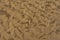 Rippled golden brown desert sand Texture background