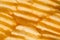 Rippled potato chips background