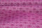 Rippled purple patterned ethnic fabric background