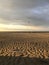 Rippled sand dunes in early morning light on Grado beach - Italy