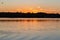 Ripples from water craft or boat on the lake at dusk with ripples on the lake