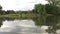 Ripples on the water and reflection of trees in Liberty Park Lake. Trees and mountains on the background