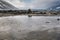 Rippling Sand Patterns on Alaska Beach with Distant Waves on Rocky Shore