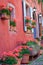 Riquewihr alsatian architecture at springtime with flowers, Eastern France