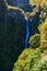 Risco Waterfall - Hiking on Levada trail 25 Fontes in Laurel forest at Rabacal - beautiful landscape scenery - Madeira Island,