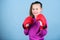 Rise of women boxers. Girl cute boxer on blue background. With great power comes great responsibility. Contrary to