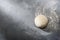 Risen or proved yeast dough for bread or pizza on a floured slate surface