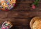 Rishtan Uzbek national plate and mug, journey cake bread and pink flowers on wooden background
