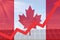 Rising arrow against Canada flag with electric towers and solar panels. Energy supply in Canada