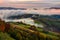 Rising cloud covers rural fields in mountains