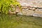 Rising damp on a brick wall in a channel full of water