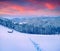 Rising moon above Gorgany ridge in winter Carpathian mountains.