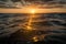 rising sun shines over oil slick in calm and peaceful ocean