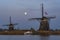 The rising Super Moon behind the windmills Tweemanspolder Nr. 2, and 3 along the Rottemeren near Zevenhuizen, The Netherlands