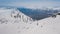 Rising up over amazing winter landscape surrounded by clear white snow aerial shot