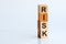RISK cube wooden blocks on white table background. Home, Crisis, Economic recession, Buy concept. Free space on the left