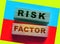 Risk factor words on wooden blocks. Healthcare or business startup causes of failure concept