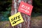 Risk versus safe words written on papers on a tree with arrow signs. Taking the risky way or secure path in decision making