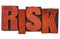 Risk word abstract in wood type