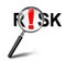 Risk word and red exclamation mark with magnifying glass on whit