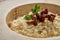 Risoto with chanterelle mushrooms in large plate. Side view, close up