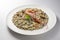 Risotto dish with prawns and seafood and parsley