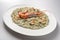 Risotto dish with spinach prawns and seafood