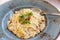 Risotto plate with cheese and microgreens. Traditional Italian cuisine. Close-up