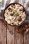 Risotto with porcini mushrooms and thyme close-up. Vertical top