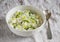 Risotto with zucchini in a white bowl