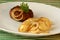 Rissole with grilled potato and onion