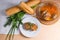 Rissole of pork served on a white plate with white wheat bread a