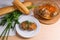 Rissole of pork served on a white plate with white wheat bread a